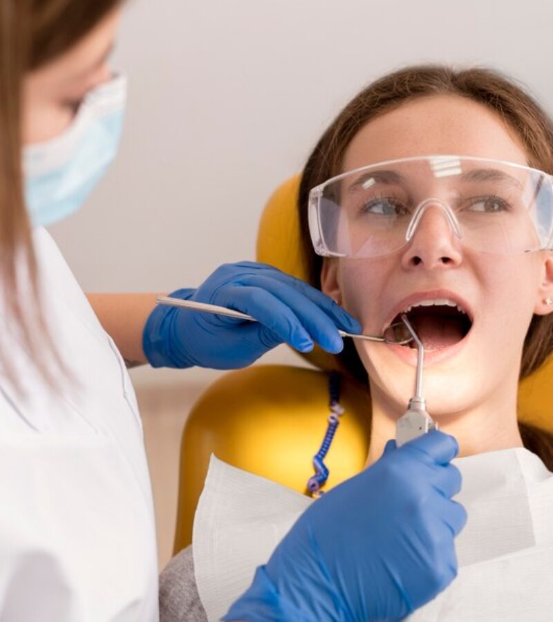 dentist-checking-patient-mounth-care_23-2149195922