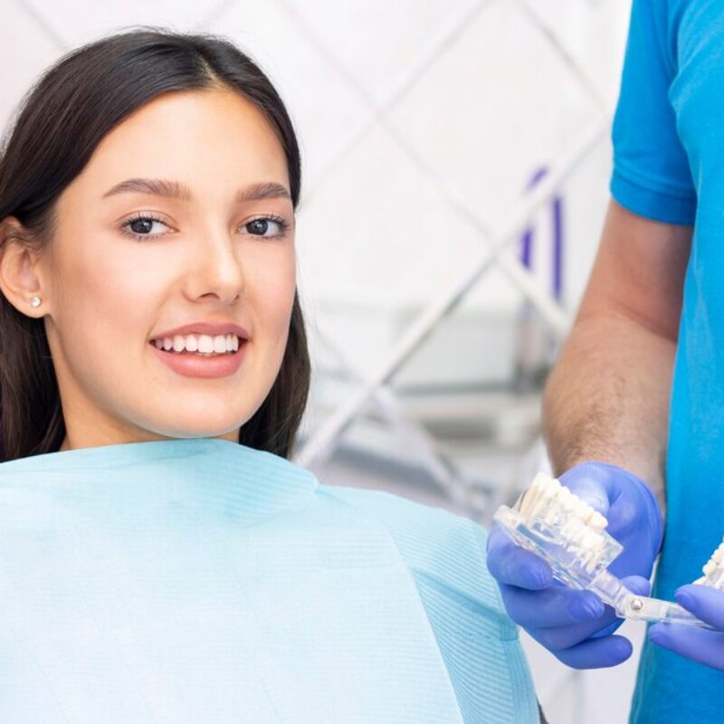 dentist-patient-dental-office-woman-having-teeth-examined-by-dentists_170532-3112