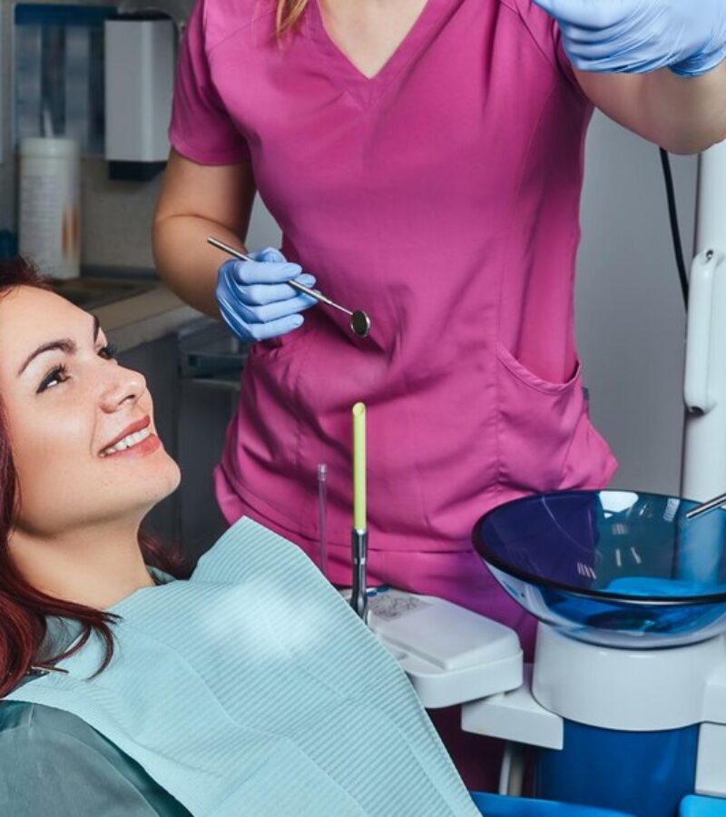 young-redhead-woman-having-examination-while-sitting-dental-chair-clinic_613910-17749