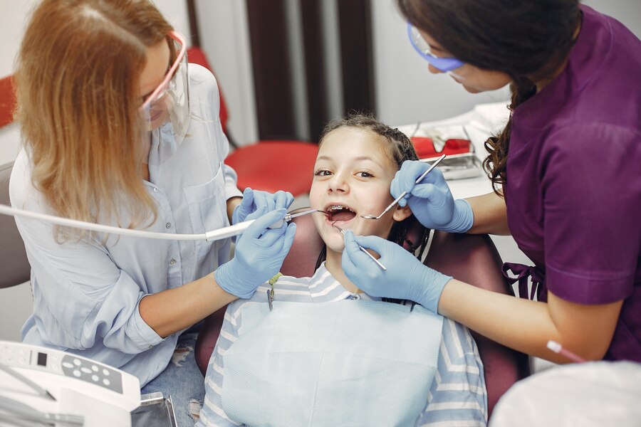 beautiful-little-girl-sitting-dentist-s-office_1157-23496